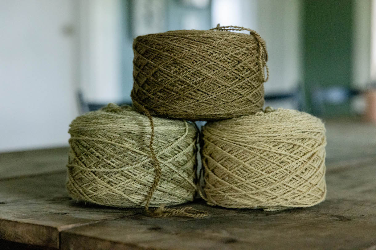 Hand-dyned spools of yarn.